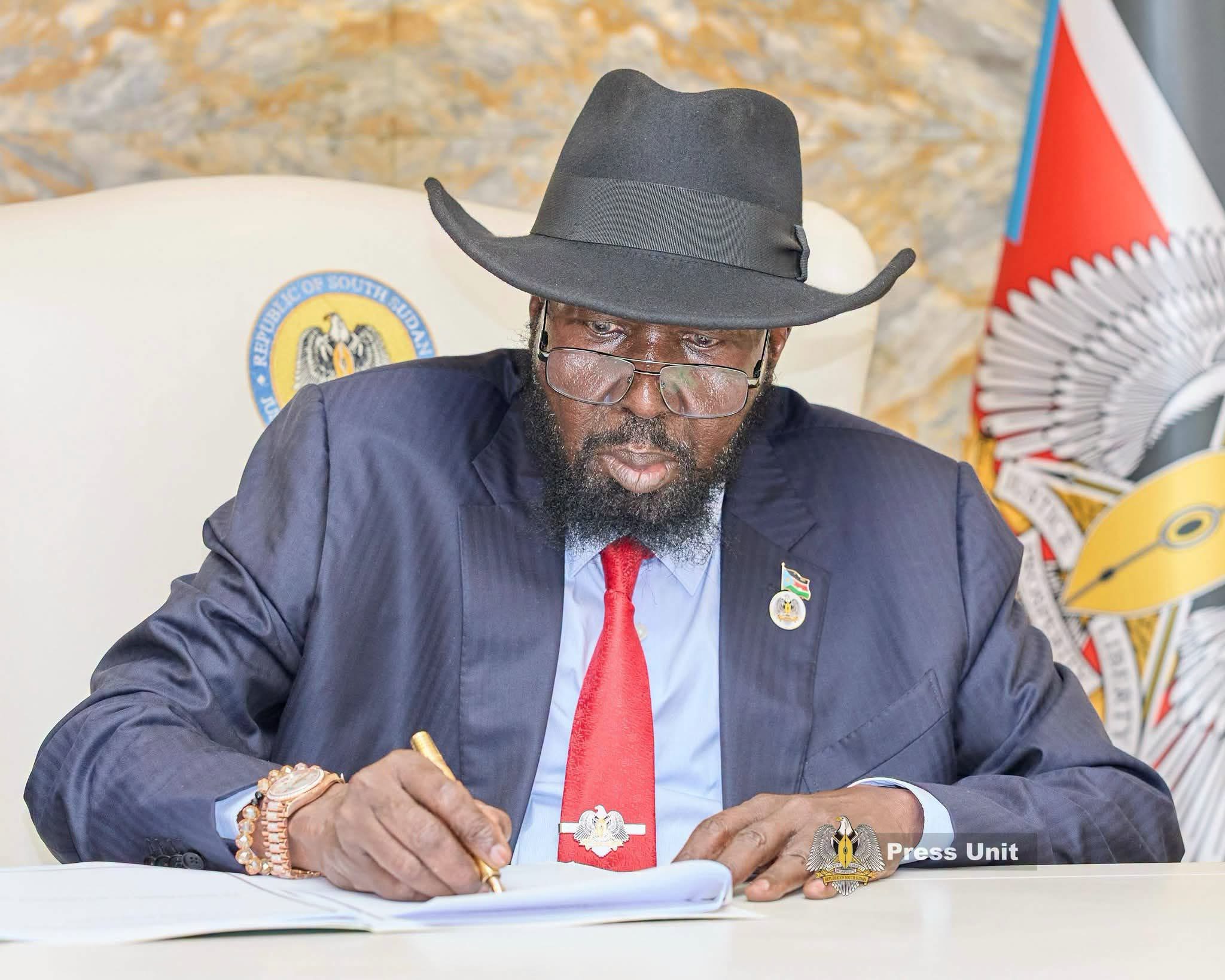 President Salva Kiir signing official documents